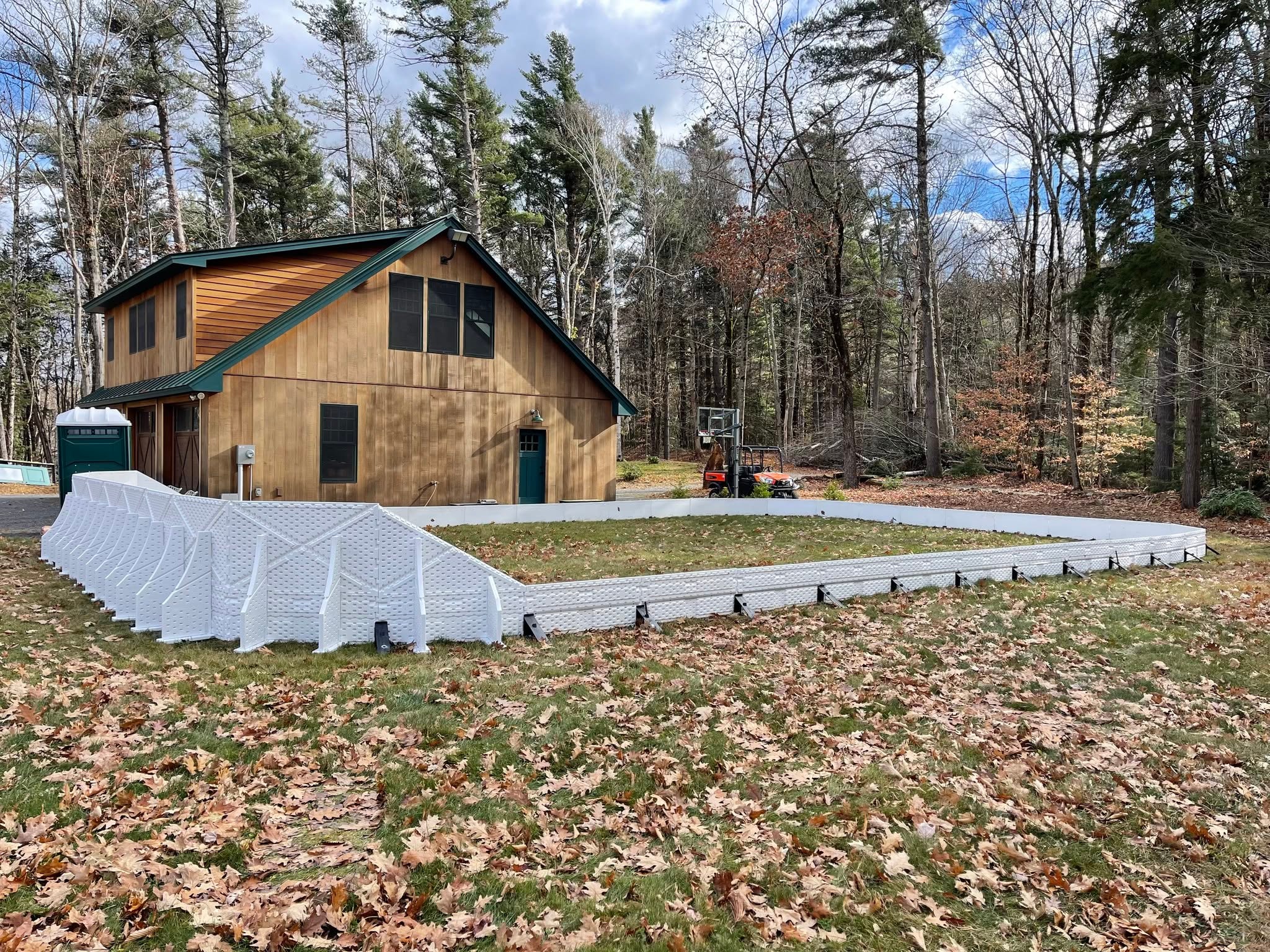Kids playing hockey on a backyard rink