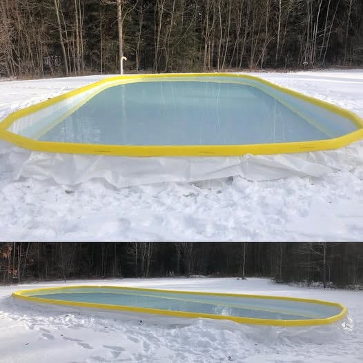 Backyard rink with hockey net in snowy yard